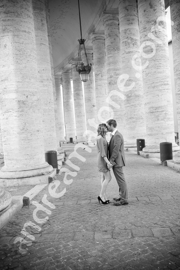 Kissing under collonade at the Vatican in Italy Saint Peter's