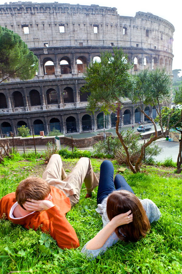 Looking together the Coliseum from a green lawn