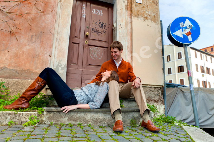 Laying down on a doorstep in the cobble like streets 