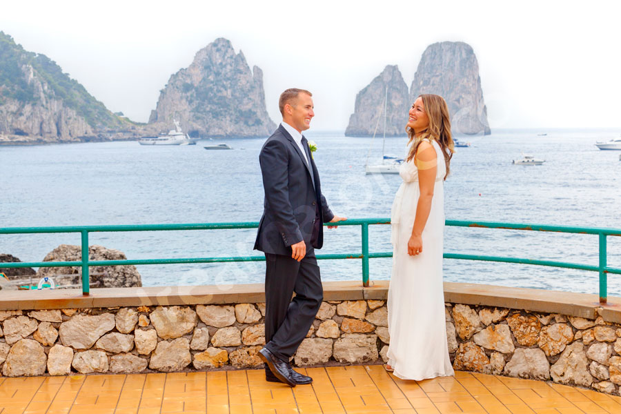Bride and groom about to get married in Capri Italy in front of the Faraglioni at Canzone del Mare. Wedding Photographer Capri.