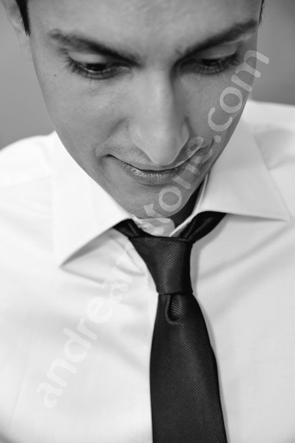 Groom looking down in black and white image