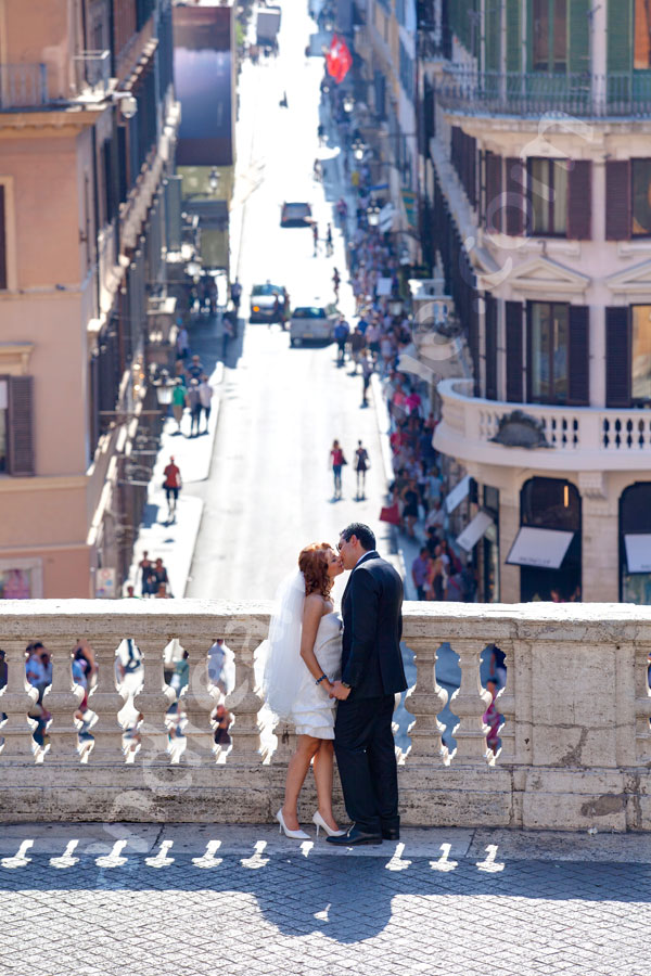 Tender kiss at Piazza di Spagna Spanish steps. Nice view over via Condotti.