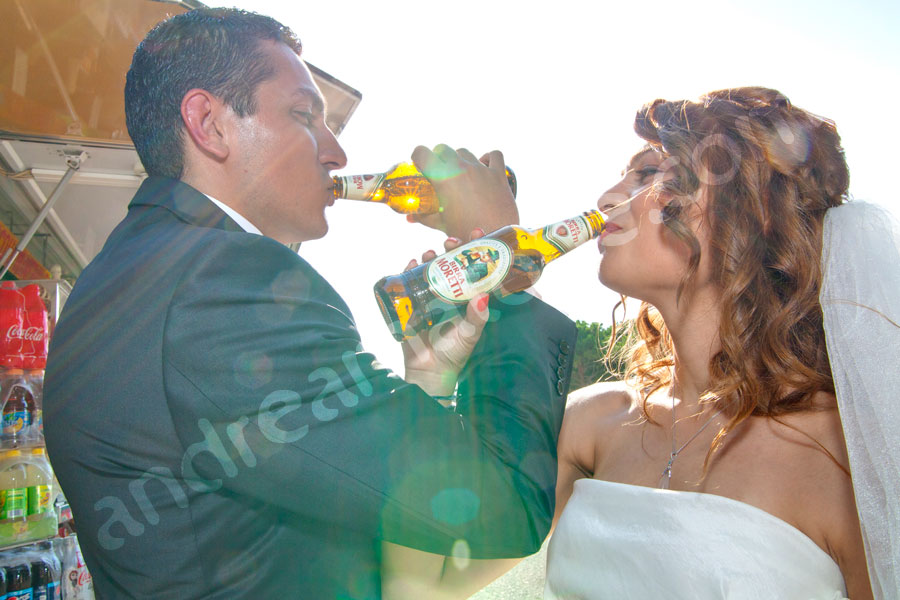 Wedding couple drinking Birra moretti beer