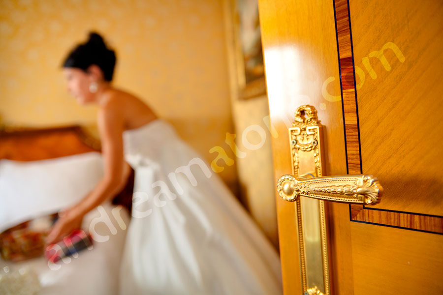 Door handle and the bride getting ready to exit