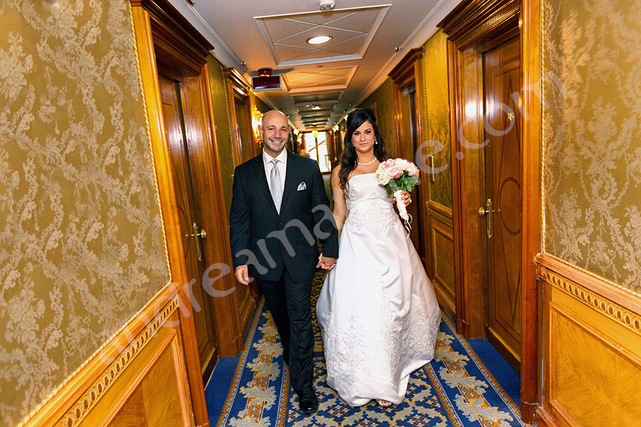 newlyweds walking hand in hand inside Hotel Parco dei Principi