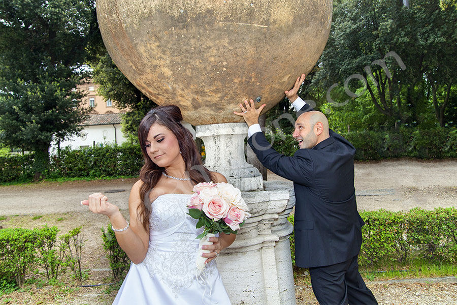 Groom holding a great deal of weight. Rome wedding photo shoot.