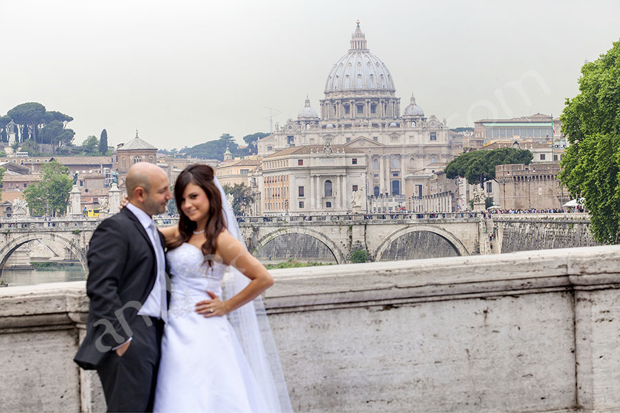 Wedding couple on Ponte Umberto in Rome with Saint Peter's in the distance 