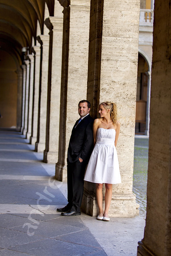 Newlyweds posing at San Ivo alla Sapienza in the city center