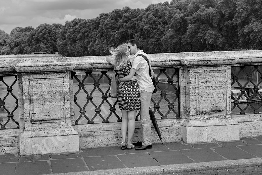 Couple kissing after she said yes. 