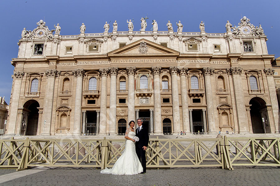 Wedding couple photographed in front of Saint Peter's Basilica in the Vatican Rome Italy
