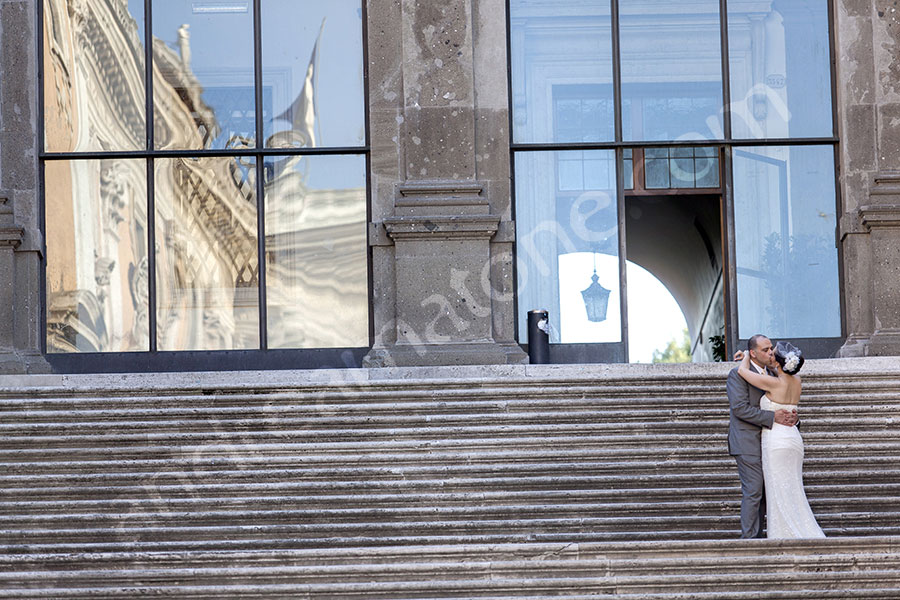 Couple standing on top of the Campidoglio stairs in Rome 