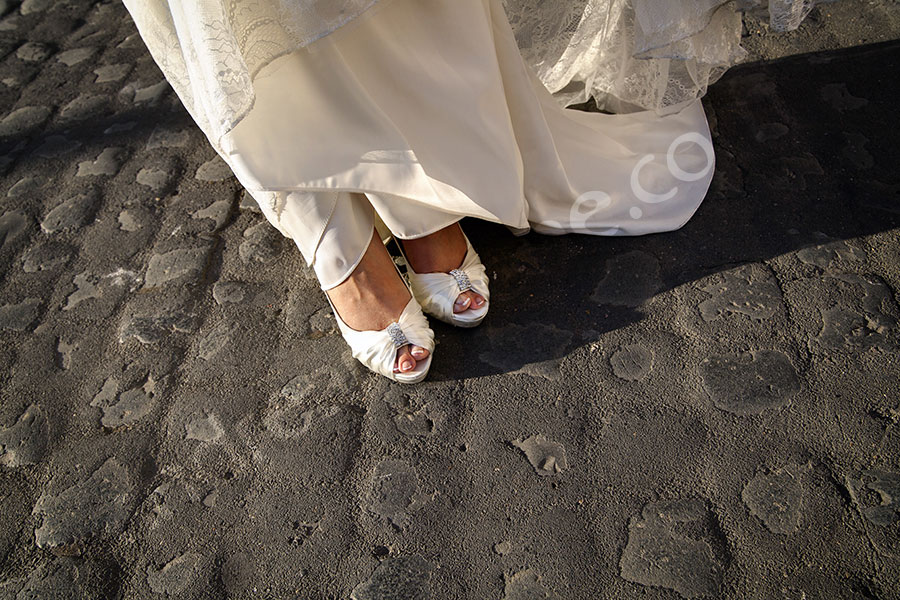 The bride's wedding shoes and dress 