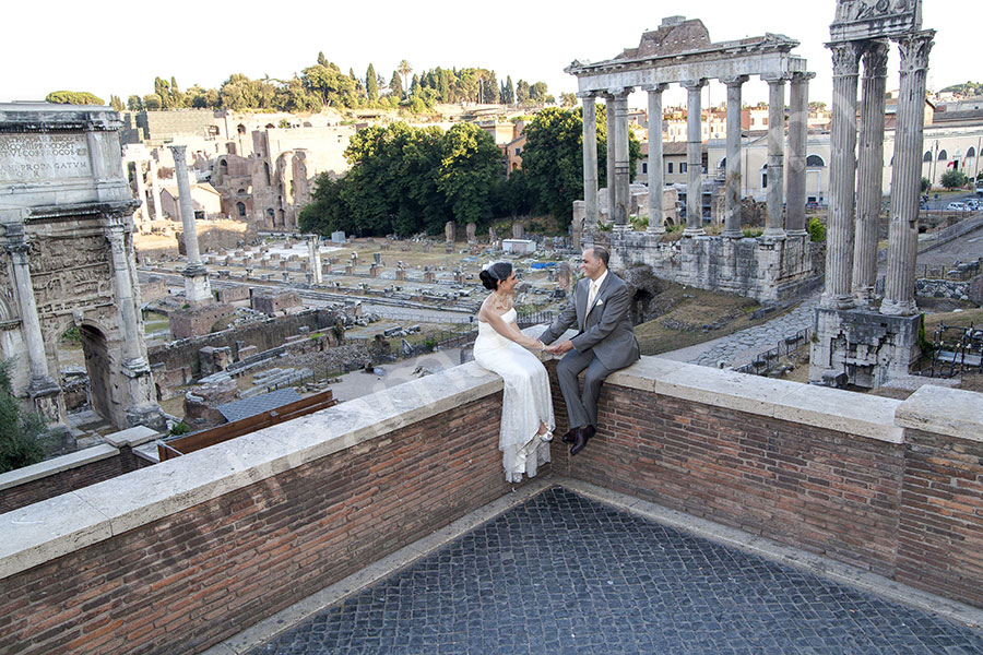 Newlyweds sitting down and chatting at the Roman Forum