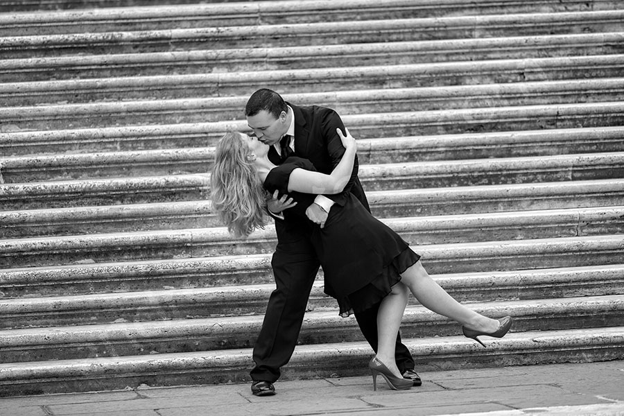 Romance and lifestyle imagery from a set of stairs contained on Piazza del Campidoglio