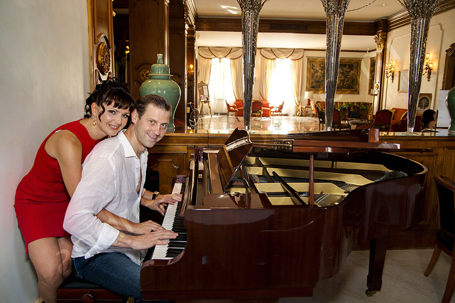 Playing the piano together inside Hotel Androvandi