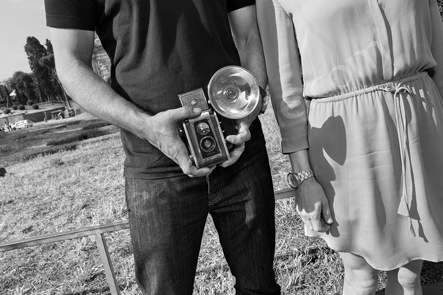 Holding a vintage kodak camera during a session