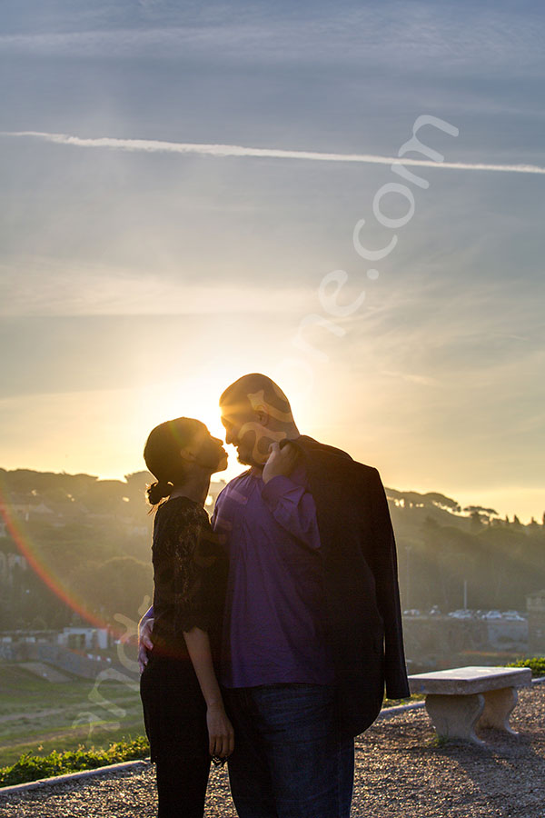 Engagement session kissing in the sunset. Silhouette version.