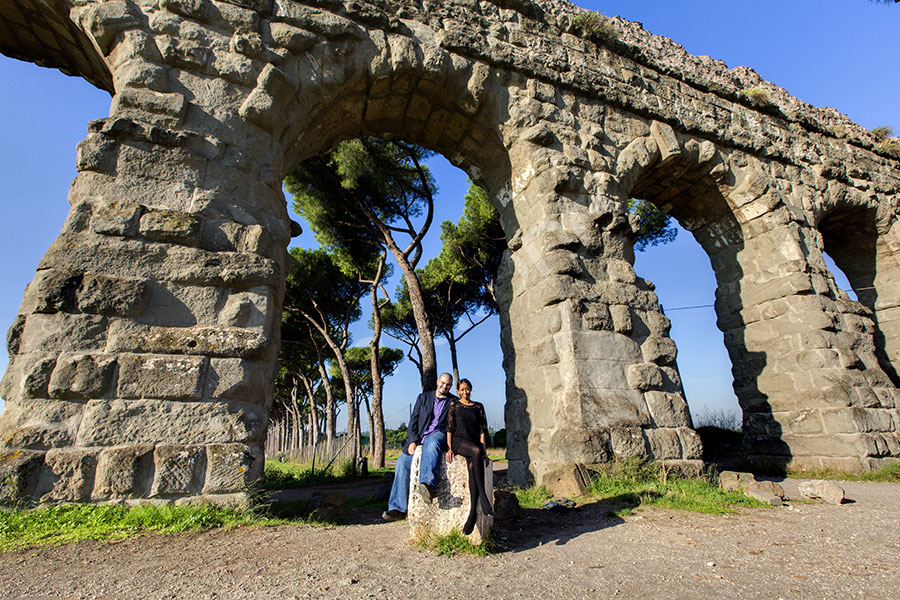 Engagement underneath huge aqueduct Italy Parco Appio 