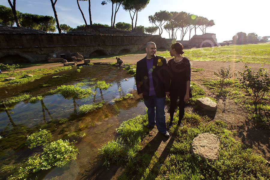 Together by a pond in a beautiful Italian park. Outdoor images.