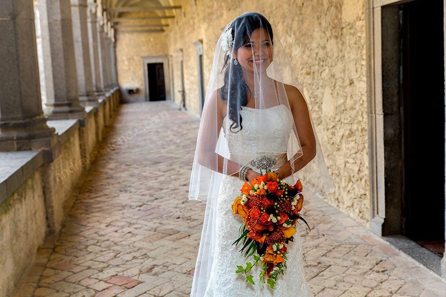 The bride posing for the photographer inside Odescalchi Castle Italy