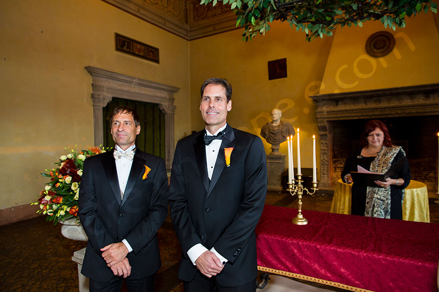 Groom and Groomsman looking as she enters the matrimonial ceremony hall