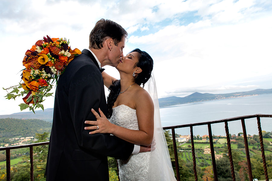 Wedding photographer Bracciano Castello Odescalchi . Wedding couple in love during wedding at Castello Odescalchi in Italy with lake view