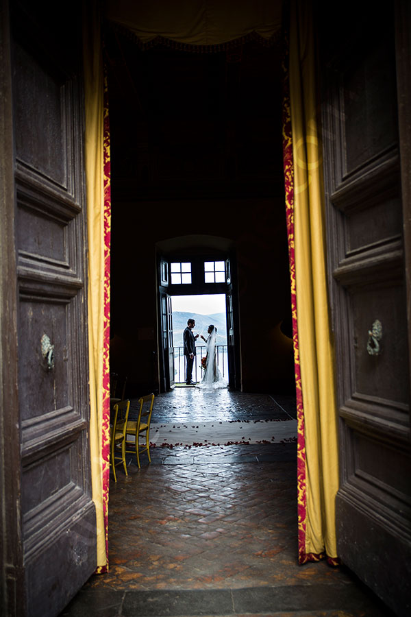 Bride and groom together inside Castello Odescalchi in Italy