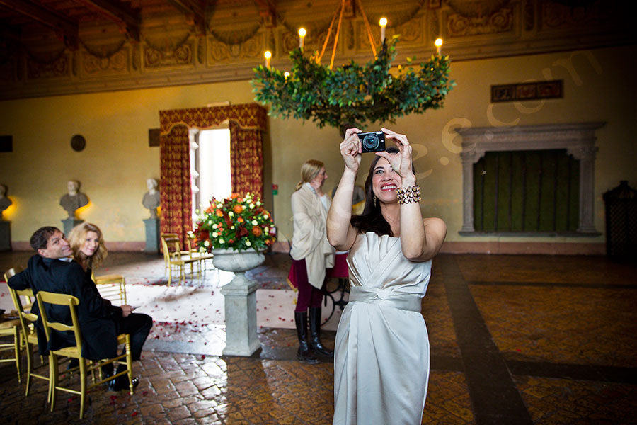 Bridesmaid photographing the newlyweds just married