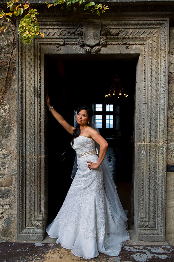 Standing on the edge of a door inside Castello Odescalchi