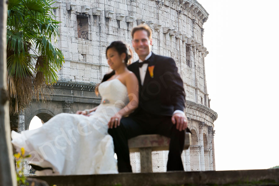 Newlyweds photographed in front of the roman Coliseum