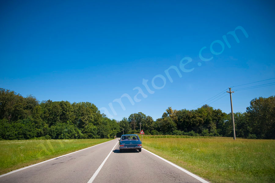 Car rental with driver driving a vintage Mercedes in Rome