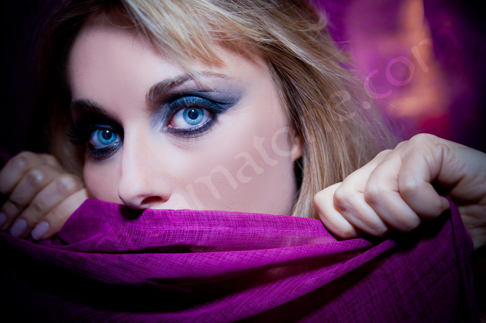 Woman face closeup during a makeup photo session in Rome