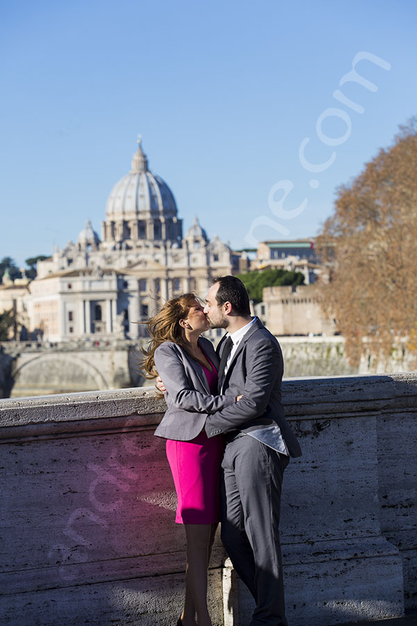 Couple together photographed from a distance with Saint Peter's dome as a backdrop