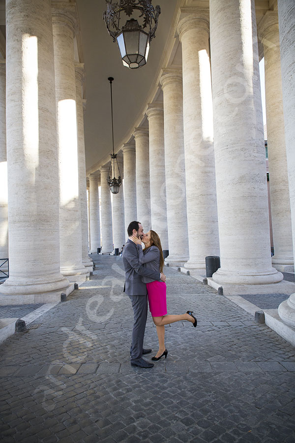 Hugging in the center of the colonnade in Saint Peter's in Rome