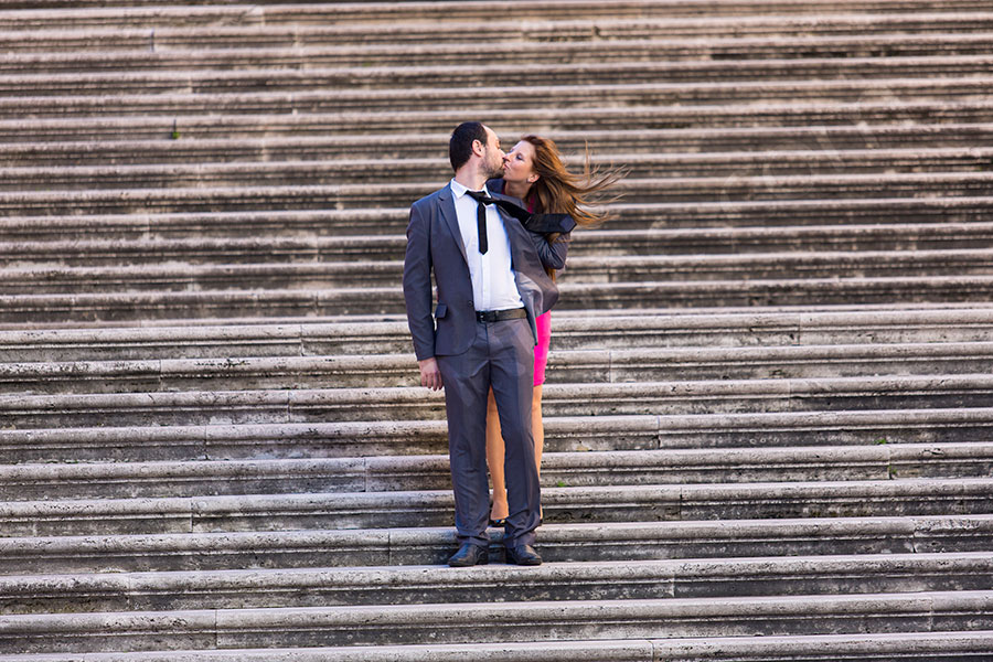 Kissing on the stairs of Piazza del Campidoglio in Rome