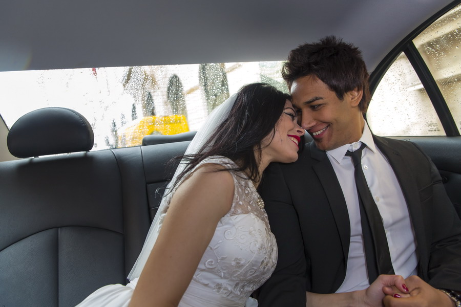 Romantic wedding picture photographed in the back of the car Color version