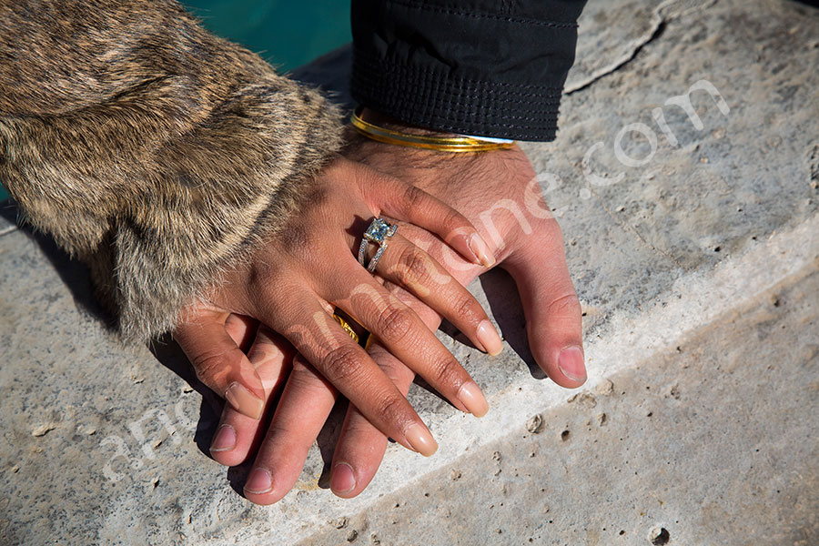 Couples hands one on top of the other after the proposal