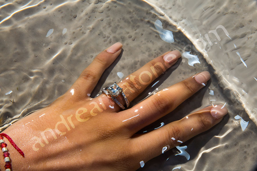 Close up of a woman's hand with an engagement ring