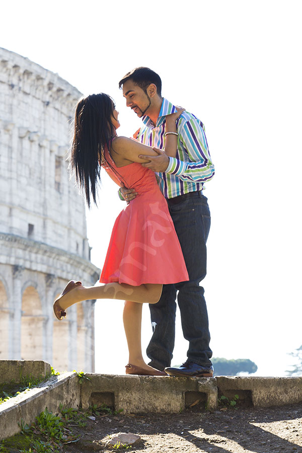 Couple in front of the Roman Colosseum 