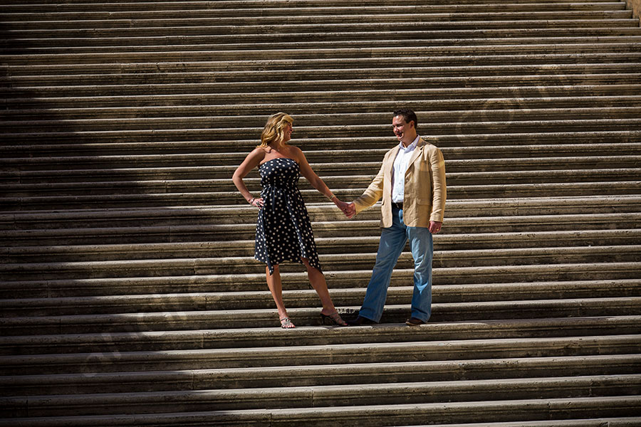 Couple standing on the stairs of Piazza del Campidoglio