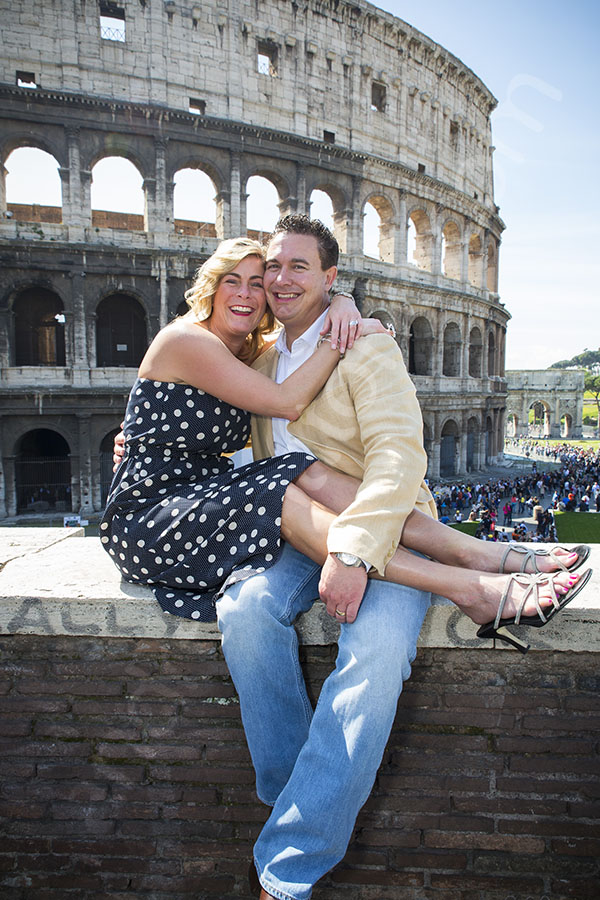 Image of a couple with the Roman Coliseum in the background 