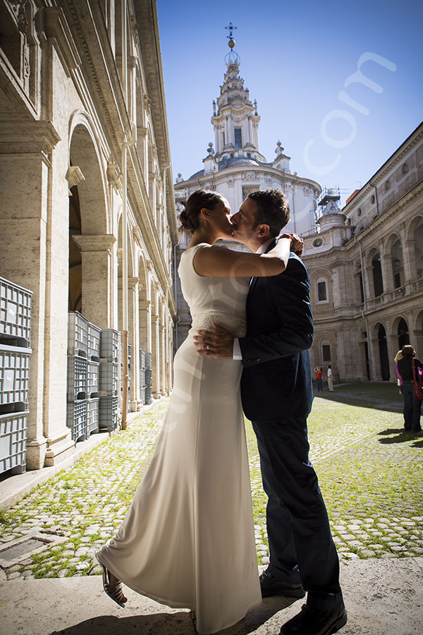 Wedding bride and groom kissing at S. Ivo alla Sapienza