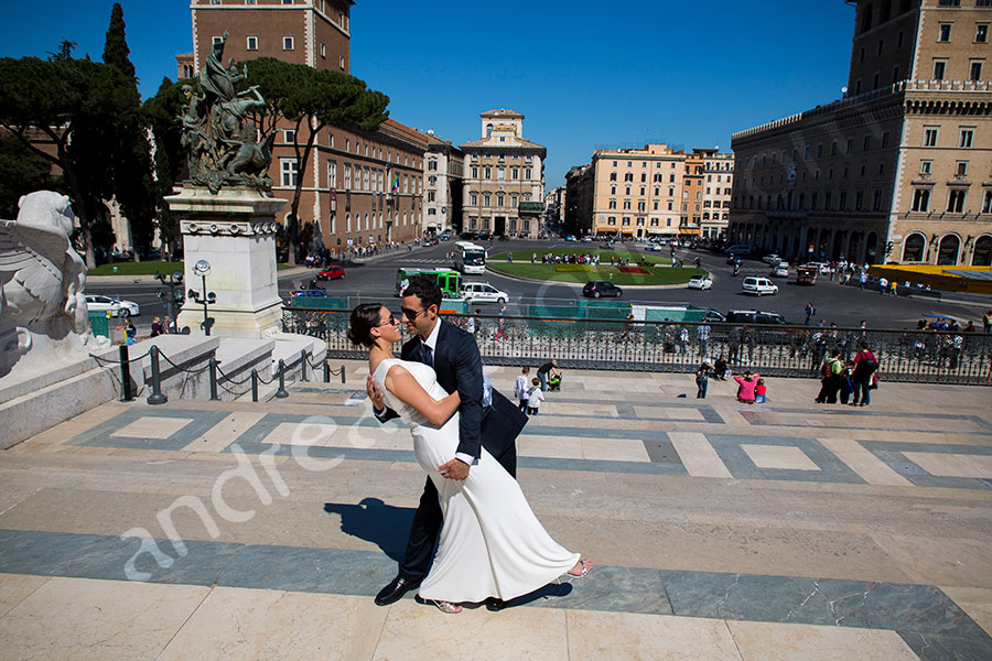 Man dipping wife during their shoot. Piazza Venezia.