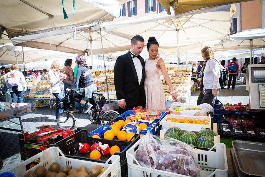 Visiting the fruit and vegetable market in Piazza Giordano Bruno during a picture session.