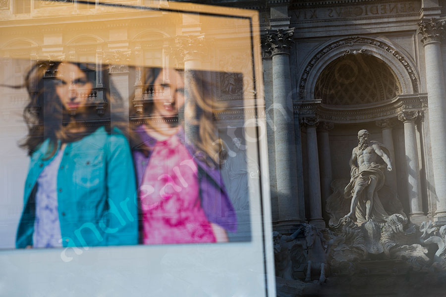 Fashion photographer window reflection of the Trevi 