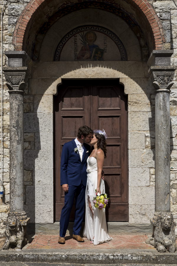 Kissing at the doorsteps of an old Church