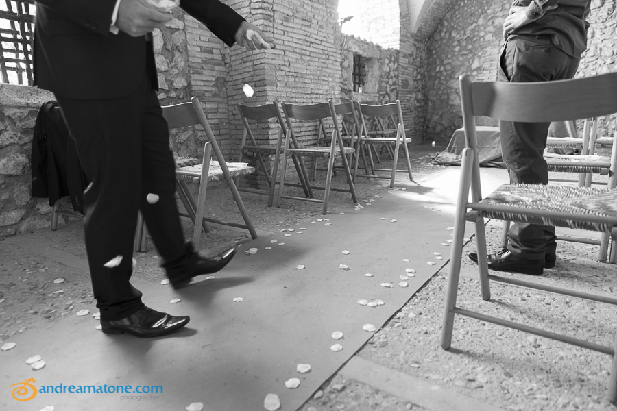 The groom prepares the room for the ceremony.