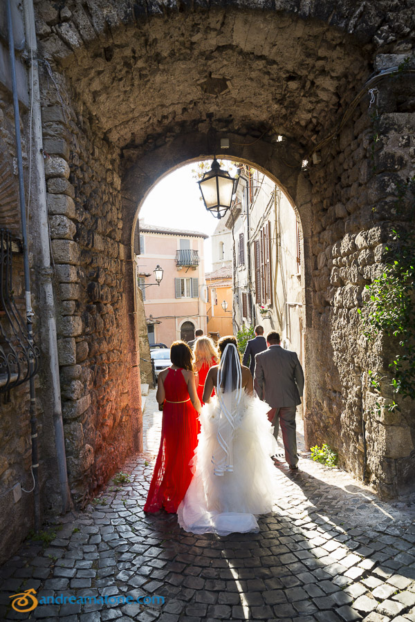 The bridal party photographed walking in Italy