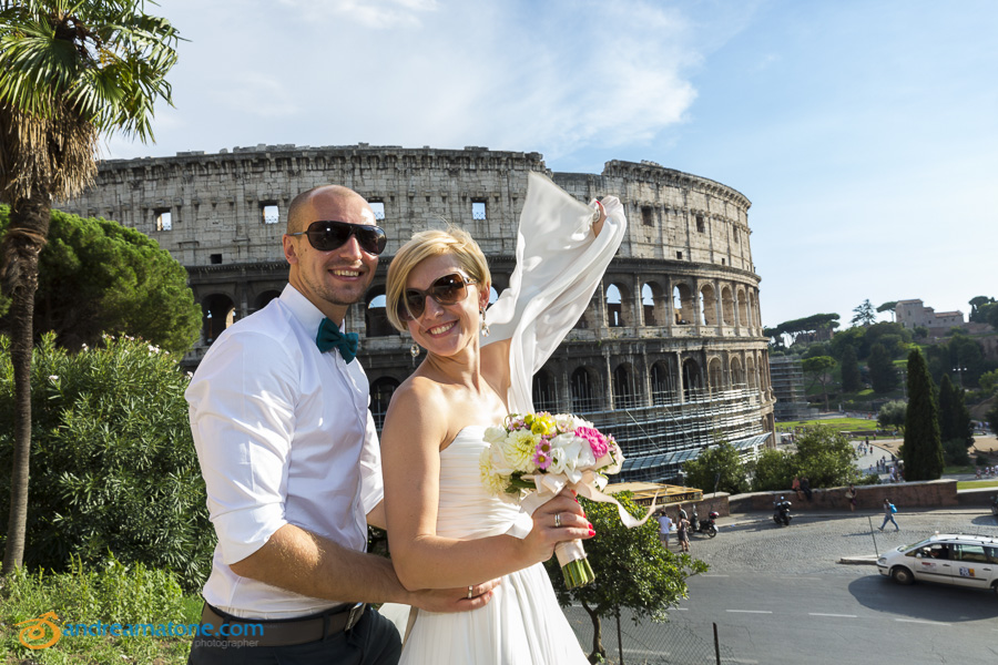 Bride and groom at the Coliseum in Rome Italy