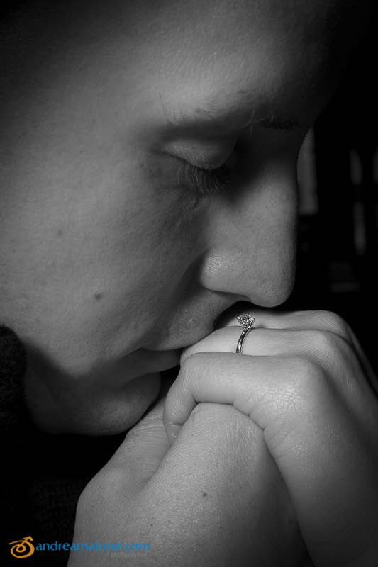 Man kissing engagement ring